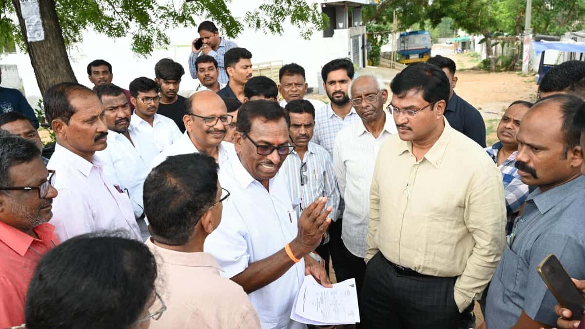 HYDRAA chief inspecting various locations across Hyderabad to resolve ongoing land disputes, accompanied by officials and local residents.
