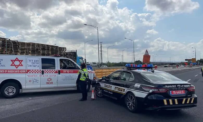 Israeli police and emergency services block a road near Ben Gurion Airport following a missile strike.