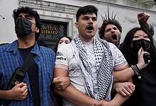 Students link arms during a pro-Palestinian protest outside Butler Library at Columbia University in New York, May 7.