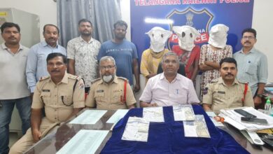 Police officials with the accused during a press briefing on the robbery pm train