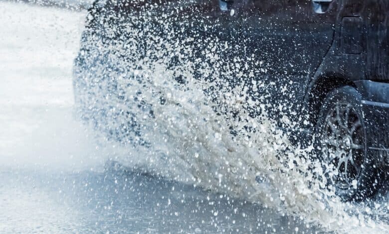 Representative image of a vehicle driving during rainfall