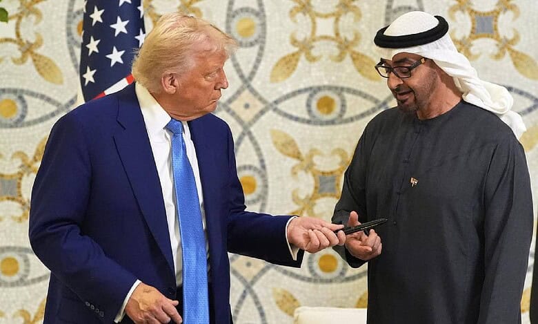 US President Donald Trump hands a pen to UAE President Mohammed bin Zayed Al Nahyan after signing the guest book at Qasr Al Watan in Abu Dhabi on May 15.