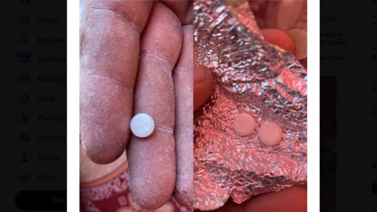 A close-up shows flour-dusted fingers holding a small round tablet marked