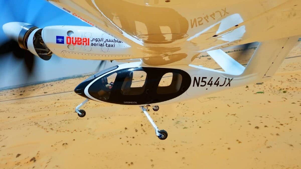 The image of a Joby Aviation’s electric aerial taxi with Dubai government branding seen mid-flight over a desert landscape during its first successful test.