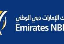 The image of a logo featuring the text "Emirates NBD" in white on a blue background, with Arabic text above and a stylised yellow and white design on the left.