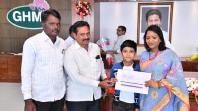 Hyderabad Mayor along with other GHMC officals offering Rs 6 lakh aid to kin of fire accident victims