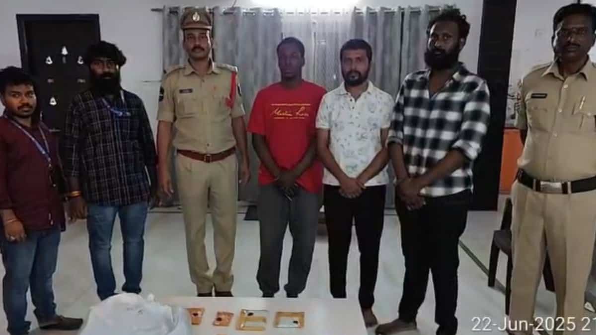 Image shows Hyderabad police standing along side three accused arrested for allegedly being involved in an international drug racket.