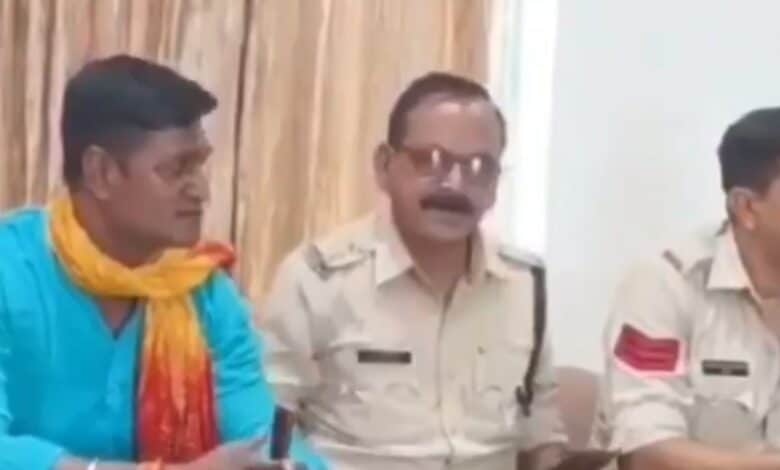 Image shows a sub-inspector in MP with fellow officers after police were called to defuse tensions sparked by Bajrang Dal members objecting to Muslim trainers at a gym in Bhopal.