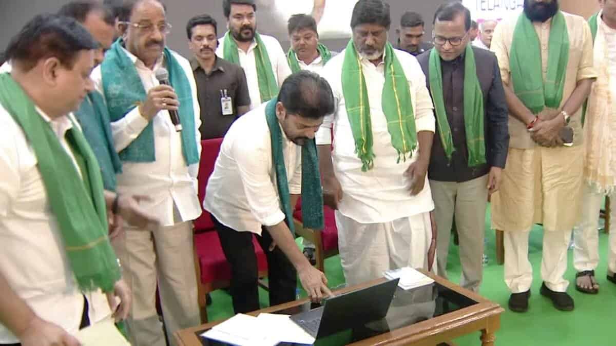 The image shows Telangana CM A Revanth Reddy releasing the Rythu Bharosa crop input financial assistance during Rythu Nestham programme in Hyderabad on Monday, June 16, 2025.
