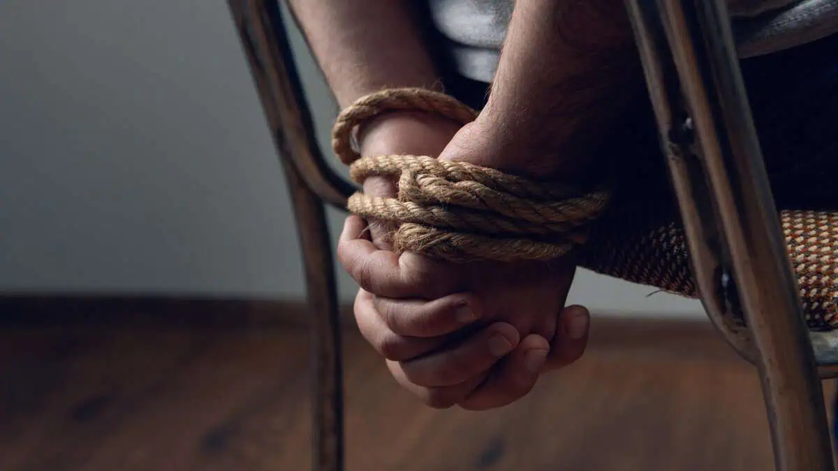 Representational image of a man tied with rope, symbolizing a kidnapping.