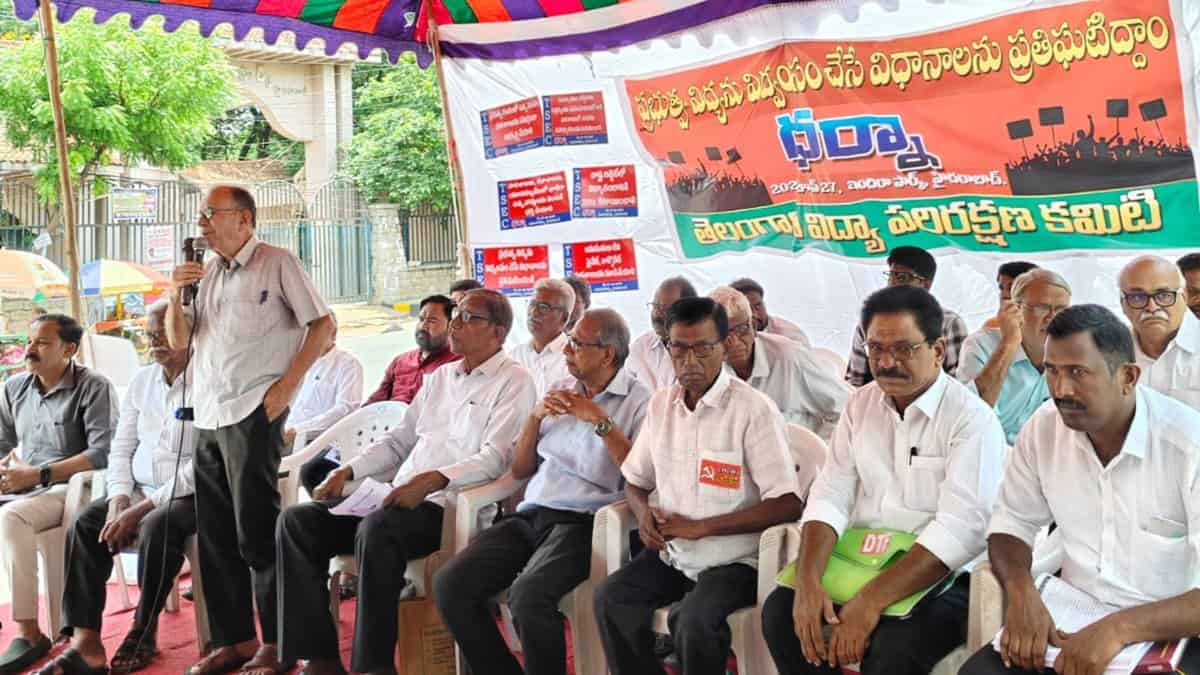 The image shows Professor G Haragopal addressing the protest of Telangana Save Education Committee held at Dharna Chowk near Indira Park on June 27, 2025.
