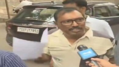 Journalist Srinivas Rao being detained