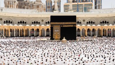 A large crowd of pilgrims gathers around the Kaaba at the Grand Mosque in Makkah during Umrah.