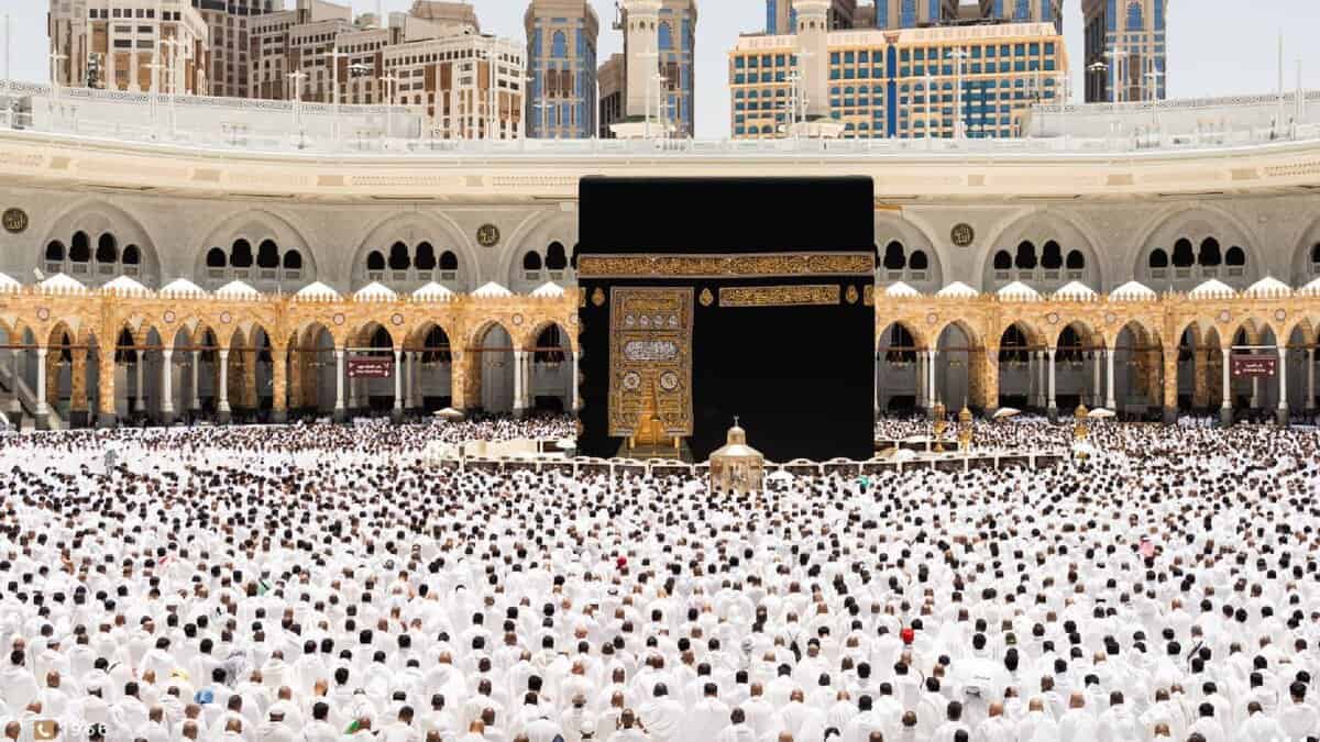 A large crowd of pilgrims gathers around the Kaaba at the Grand Mosque in Makkah during Umrah.