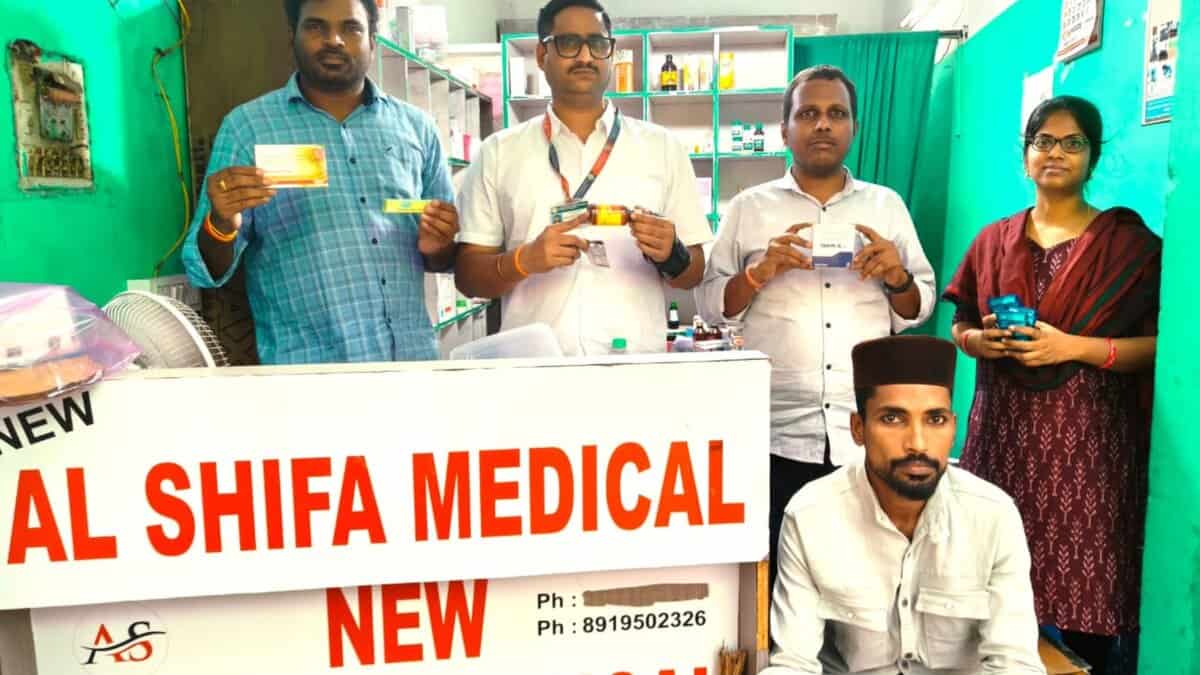 The image displays a picture of Telangana DCA officials raiding a medical shop in Hyderabad
