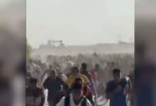 The image displays a picture of Palestinians running for their life as Israeli army opened fire in Gaza Strip