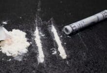 The image displays a photo in cocaine
