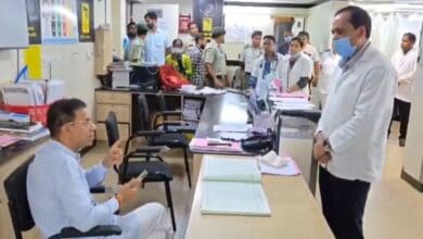 The image displays Goa health minister Vishwajit Rane (seated) losing his cool on chief medical officer Dr Rudresh Kurtikar