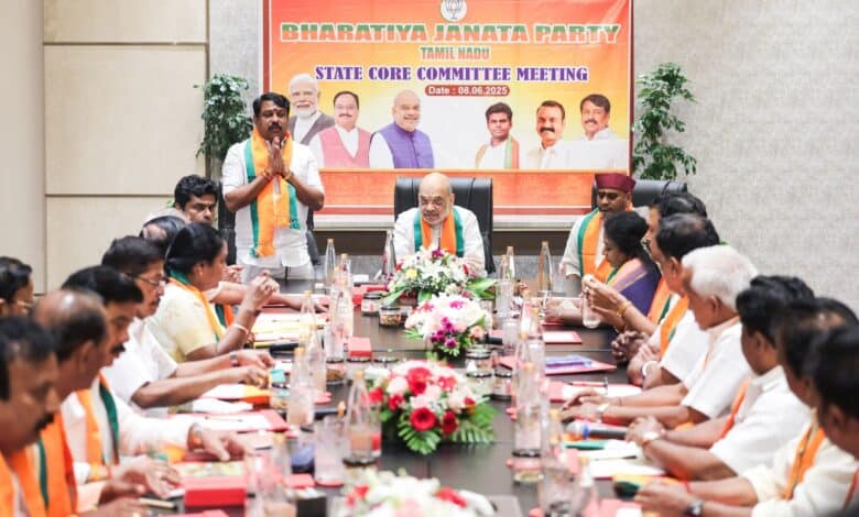 The image displays a picture of Amit Shah Shah chairing a meeting of the state core committee of the Tamil Nadu BJP.