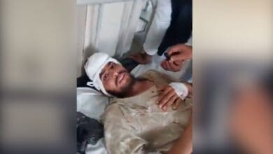The image displays a picture of an injured Muslim man whose family was attacked in Nizamabad by right-wing affiliated organisation
