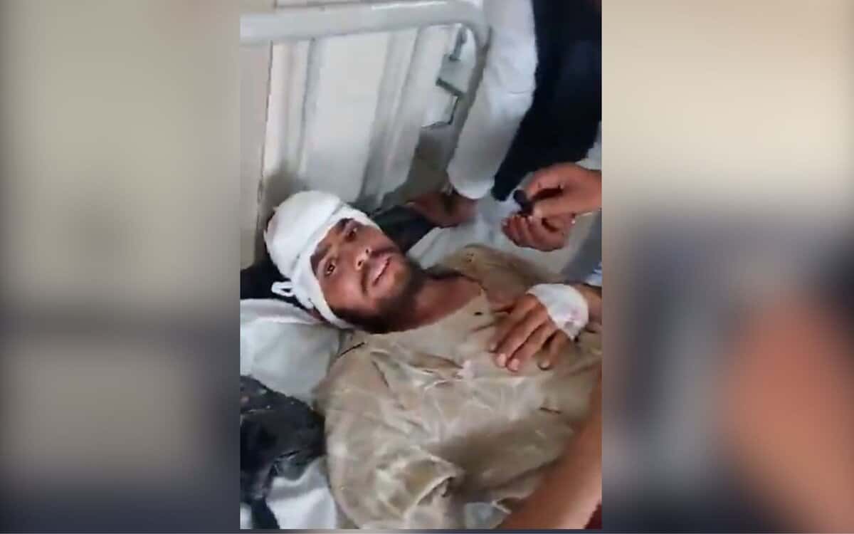 The image displays a picture of an injured Muslim man whose family was attacked in Nizamabad by right-wing affiliated organisation