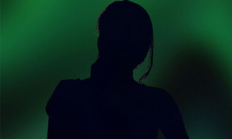The image displays a picture of a woman with green background