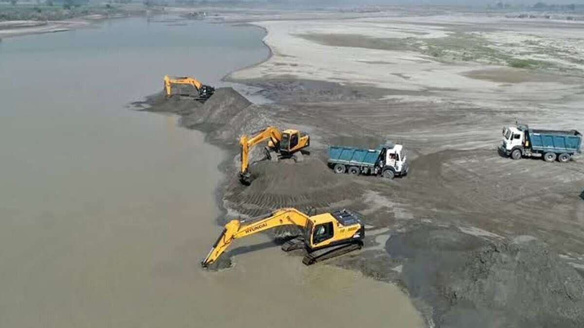 The image displays a picture of illegal sand mining in Chhattisgarh