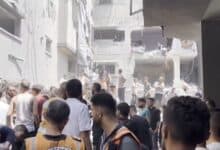 The image displays a devastation after an Israeli strike killed at least 16 Palestinians on the Gaza Strip