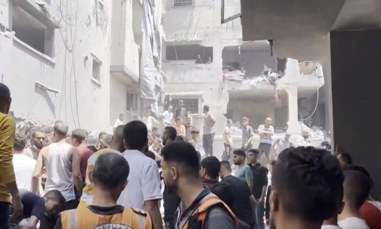 The image displays a devastation after an Israeli strike killed at least 16 Palestinians on the Gaza Strip