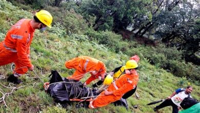 NDRF personnel retrieve a body after a helicopter crashed near the Kedarnath shrine in Rudraprayag district of Uttarakhand on Sunday.