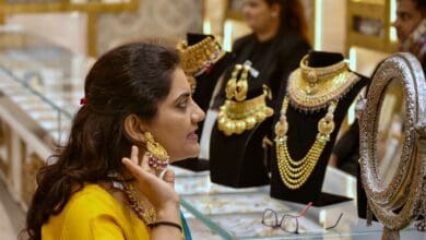 A woman tries out gold jewellery