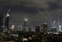 The Israeli Iron Dome air defense system fires to intercept missiles over Tel Aviv on Sunday. (AP/PTI)