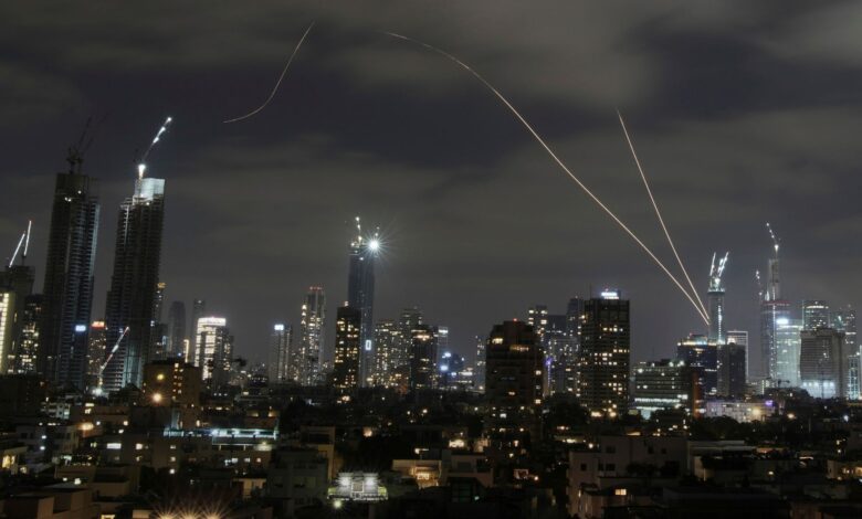 The Israeli Iron Dome air defense system fires to intercept missiles over Tel Aviv on Sunday. (AP/PTI)