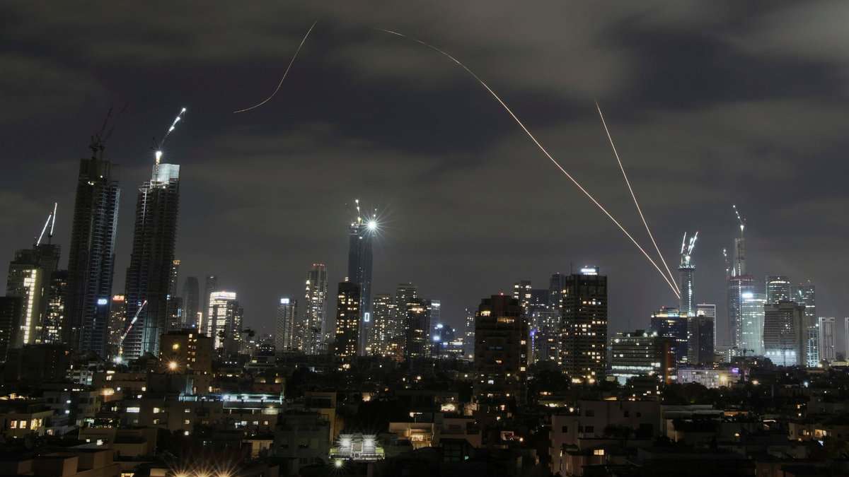 The Israeli Iron Dome air defense system fires to intercept missiles over Tel Aviv on Sunday. (AP/PTI)