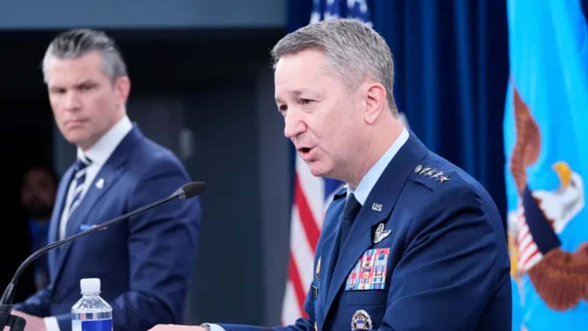 US defence secretary Pete Hegseth (background) briefing the press with chairman of the joint chiefs of staff Gen Dan Caine (foreground) on Sunday