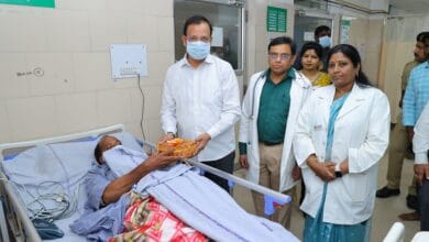 TGSRTC MD Sajjanar visits an injured staff member at the hospital.