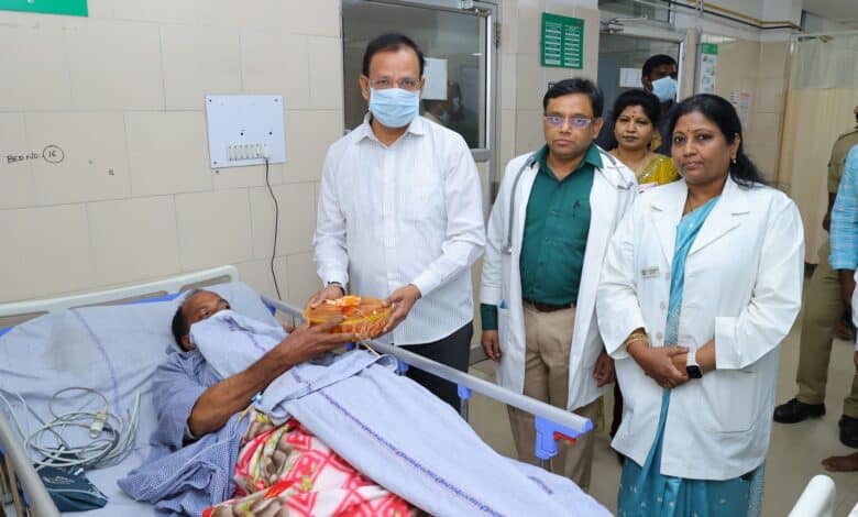 TGSRTC MD Sajjanar visits an injured staff member at the hospital.