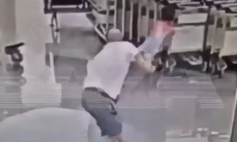 Screengrab of a man violently throwing a two-year-old Iranian child at Moscow airport