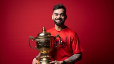 Indian cricket player Virat Kohli with IPL 2025 trophy