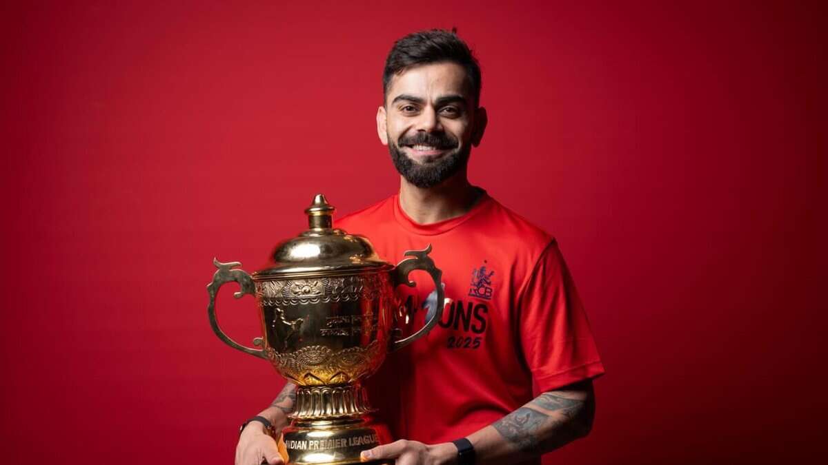 Indian cricket player Virat Kohli with IPL 2025 trophy