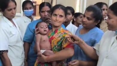 Medical staff in Medak pacify the baby