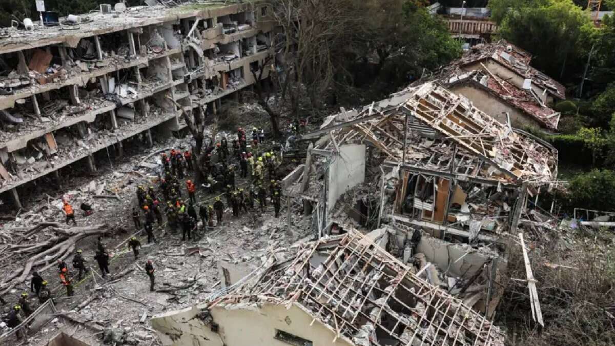 Emergency crews at the site of buildings destroyed by Iranian missile strikes in Tel Aviv. Several rockets hit residential areas, causing widespread damage.