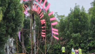 GHMC workers remove posters of KTR in Hyderabad