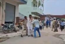 The image shows Telangana Congress NRI Cell leader N Devender Reddy being attacked by BRS MLA's henchmen in Balkonda on Thursday, July 17, 2025.