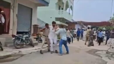The image shows Telangana Congress NRI Cell leader N Devender Reddy being attacked by BRS MLA's henchmen in Balkonda on Thursday, July 17, 2025.