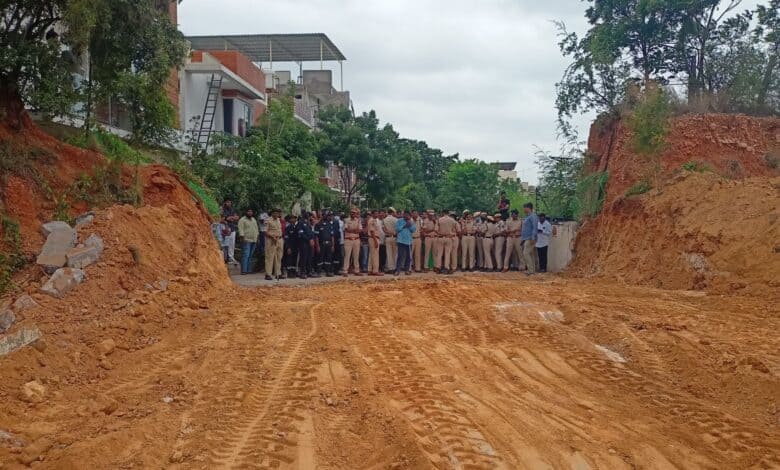 The image shows the demolished compound wall built by a realtor in Nizampet municipality of Dundigal mandal in Medchal-Malkajgiri district.