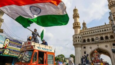 Hyderabad A man waves the national flag during a procession for the Ganesh idol immersion
