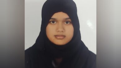 Ameena Begum wearing a black hijab, facing the camera in a passport-style photo.
