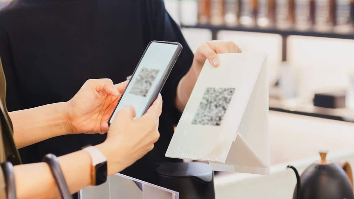 QR code being scanned by a person