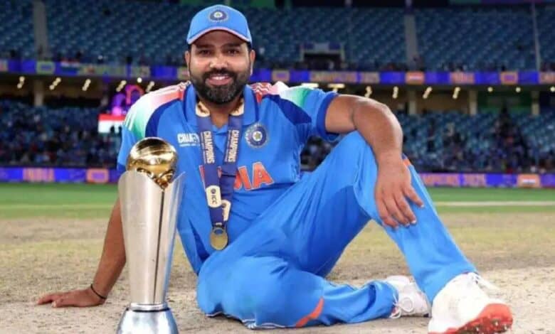 The image of a Rohit Sharma in Indian cricket jersey sitting on the field with a trophy, smiling after a championship win.